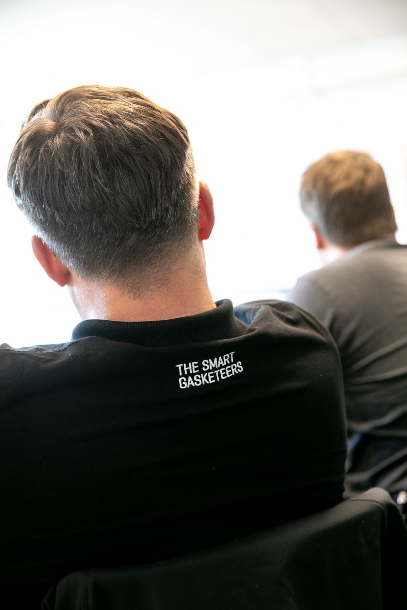 IDT employee wearing a “The Smart Gasketeers” shirt during the workshop