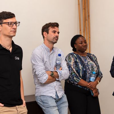 IDT team member with three business contacts during the delegation visit to Mozambique