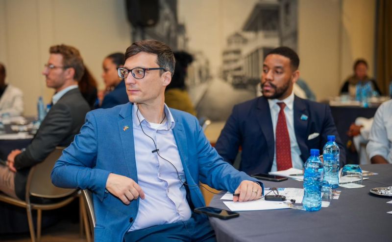 IDT team member in the audience at a business delegation event in Mozambique